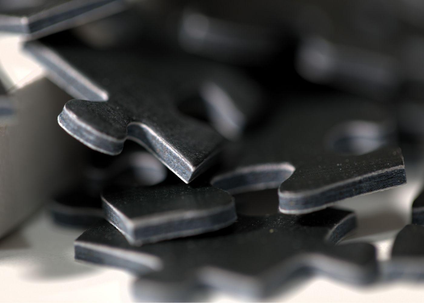 Black puzzle pieces side view