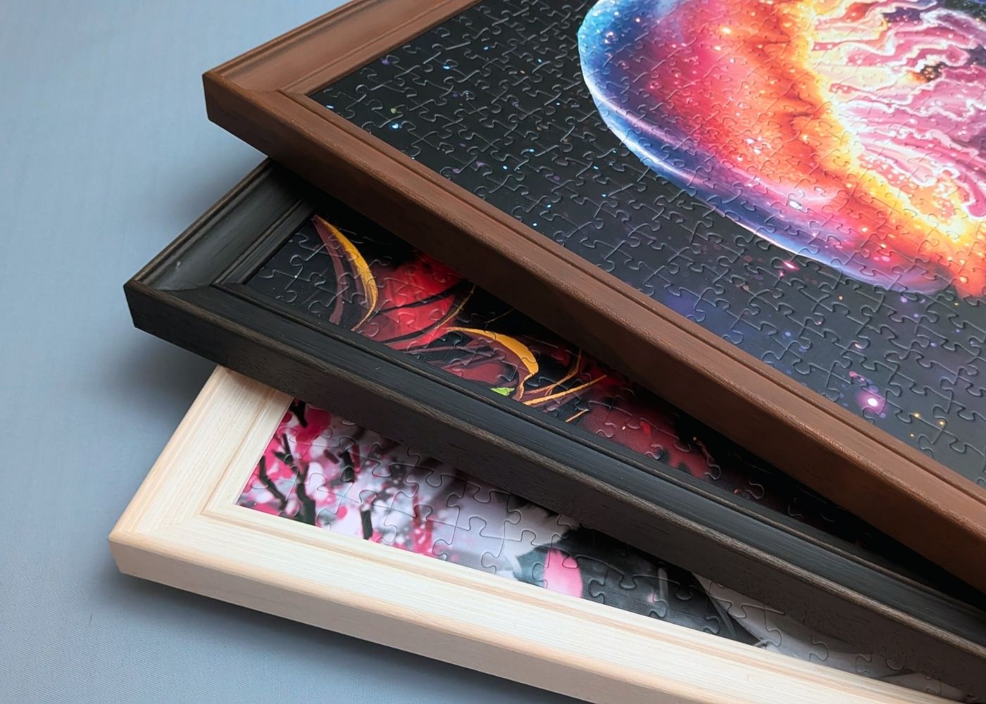Pile of framed puzzles