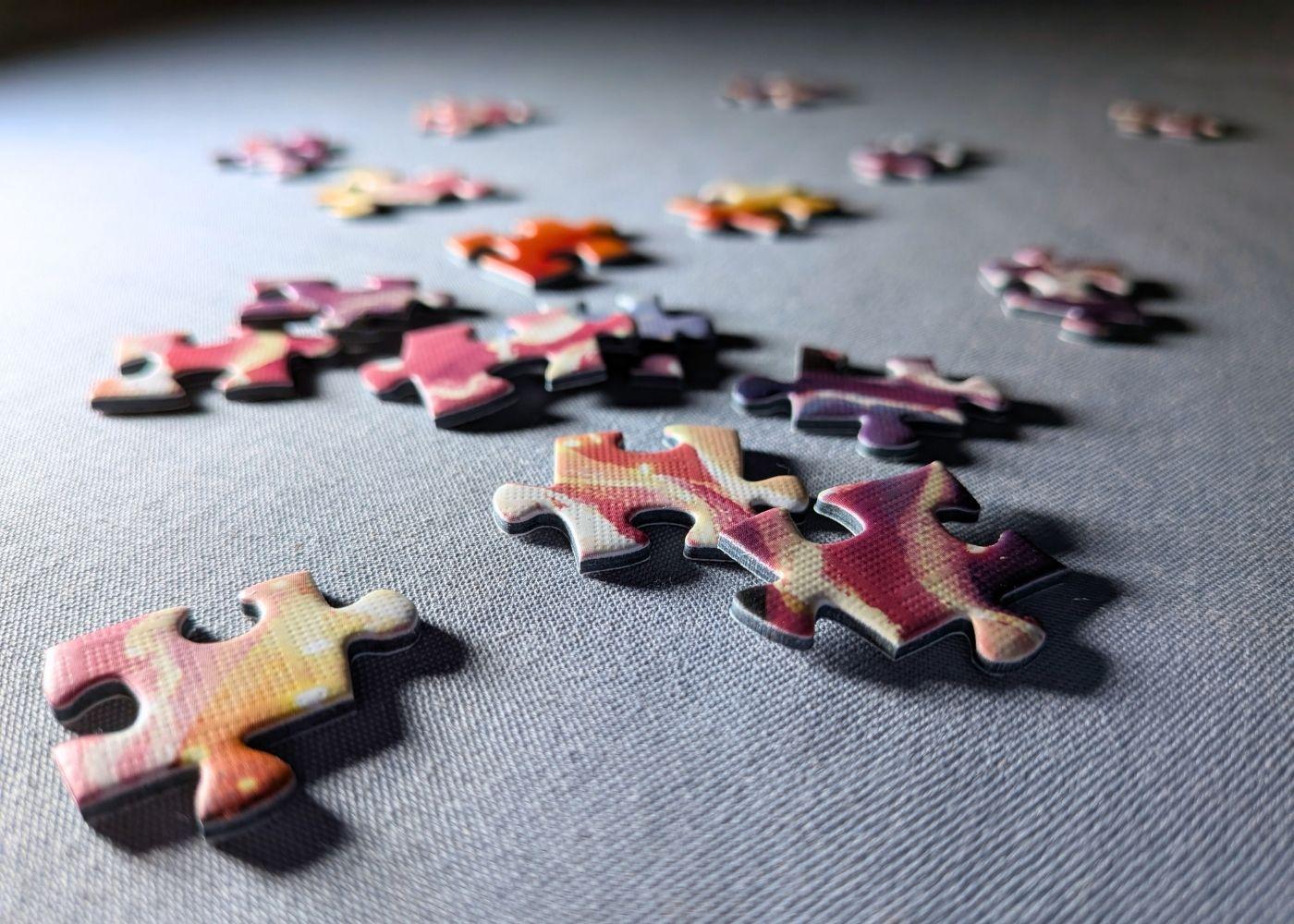 Scattered colorful puzzle pieces