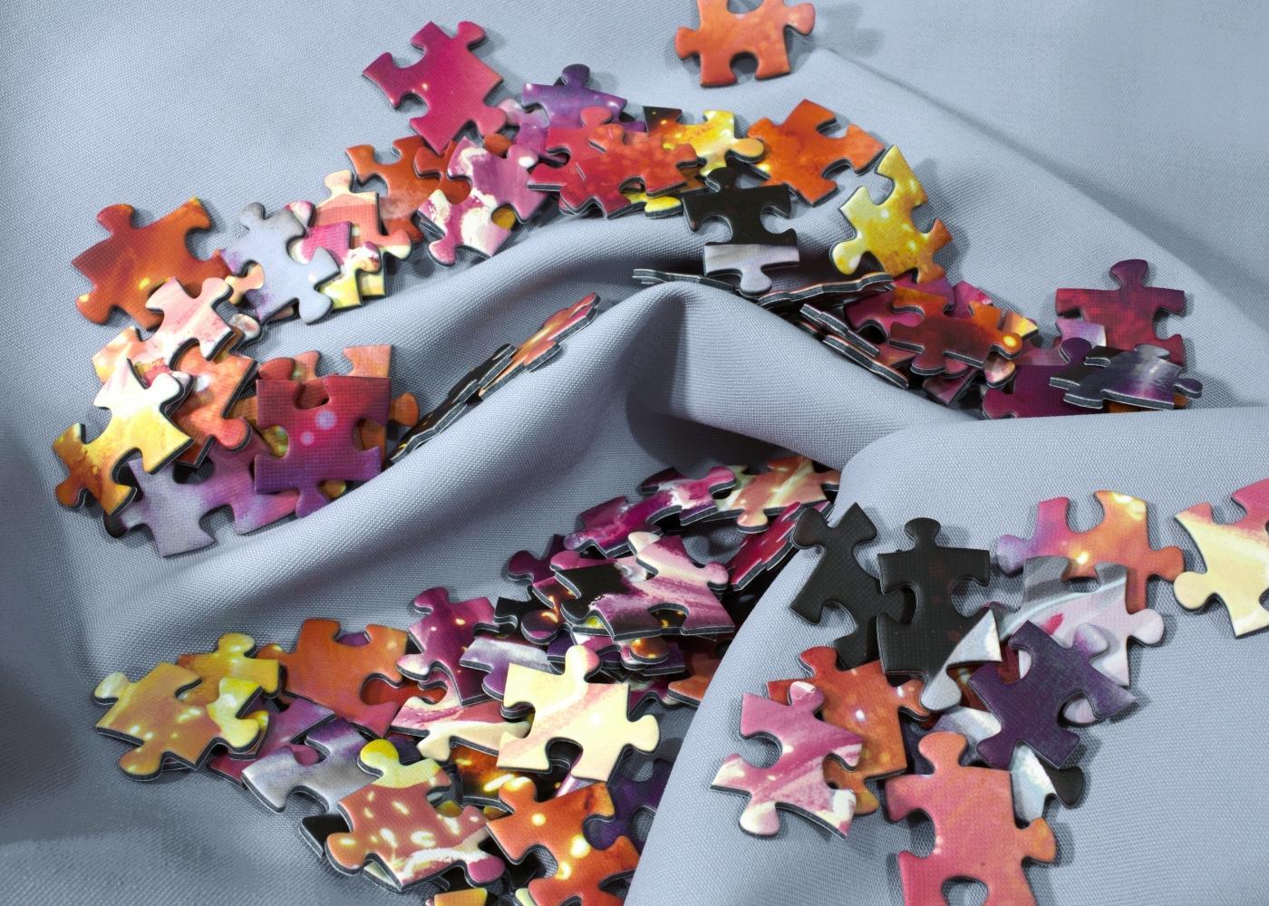 Scrambled puzzle pieces on cloth